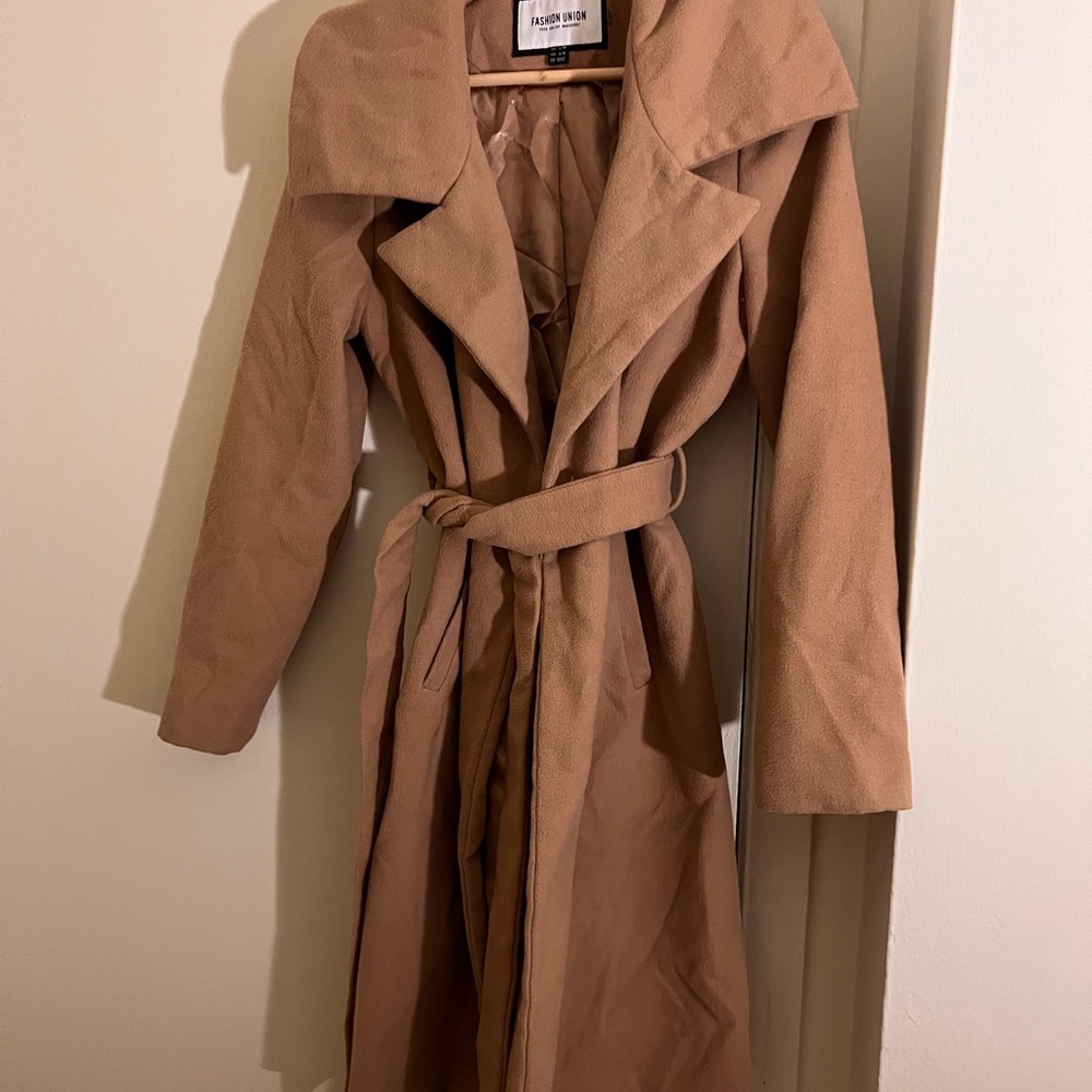This is a long tan coat, goes down to mid shin.